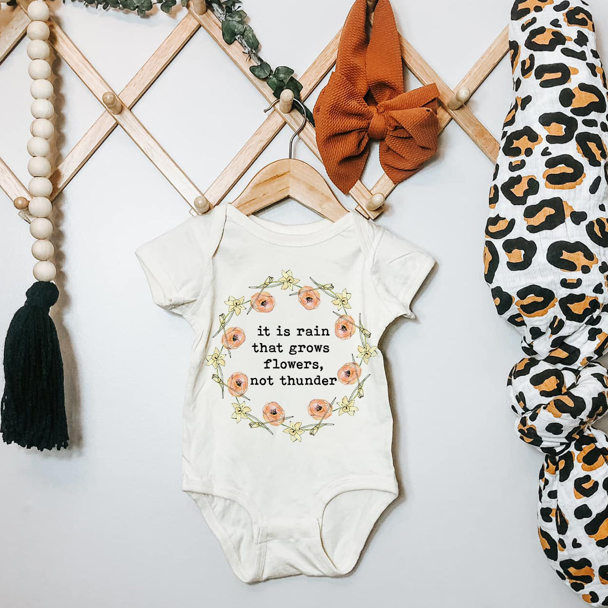 « IT IS RAIN THAT GROWS FLOWERS, NOT THUNDEr » BODYSUIT