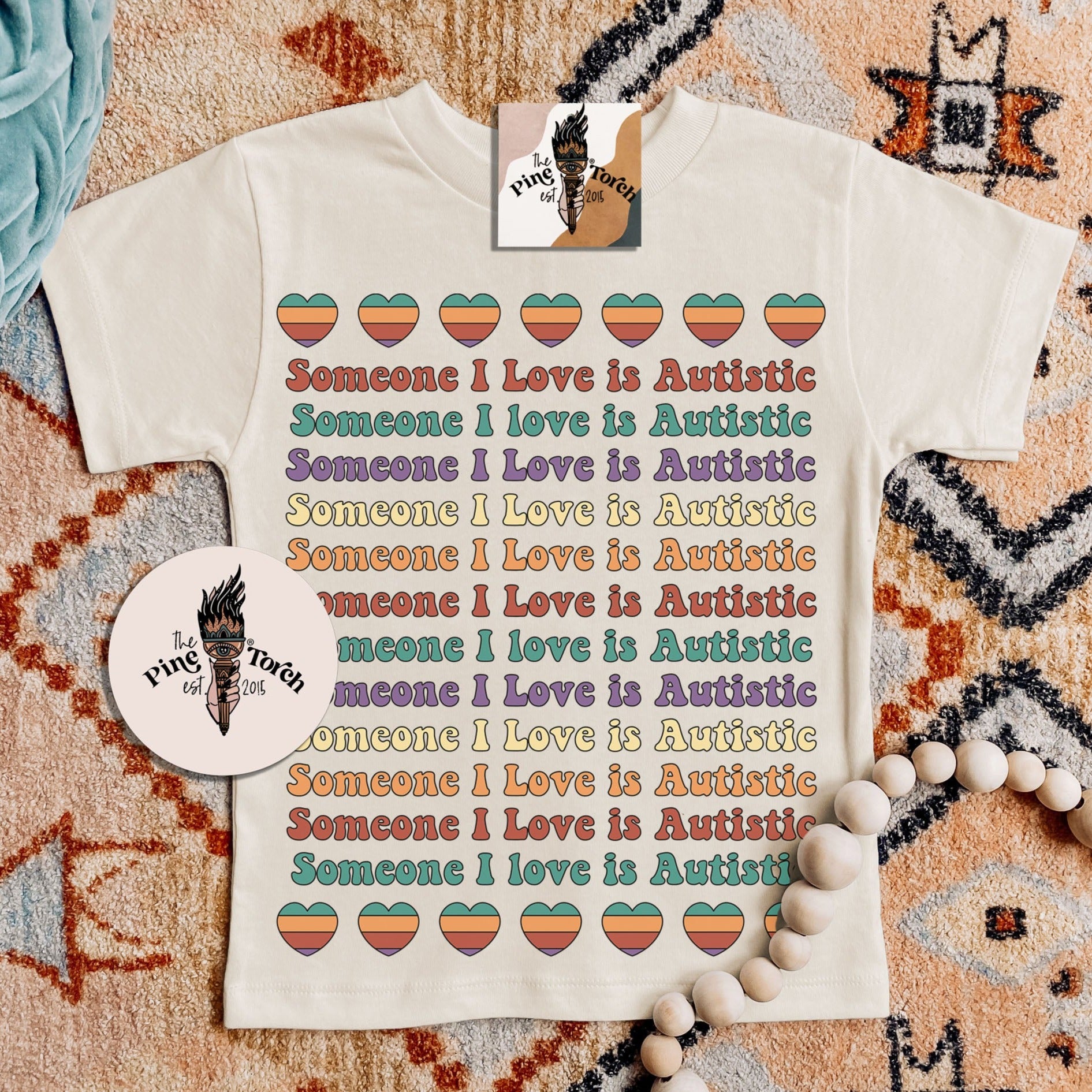 « SOMEBODY I LOVE IS AUTISTIC (RAINBOW) » KIDS/YOUTH TEE