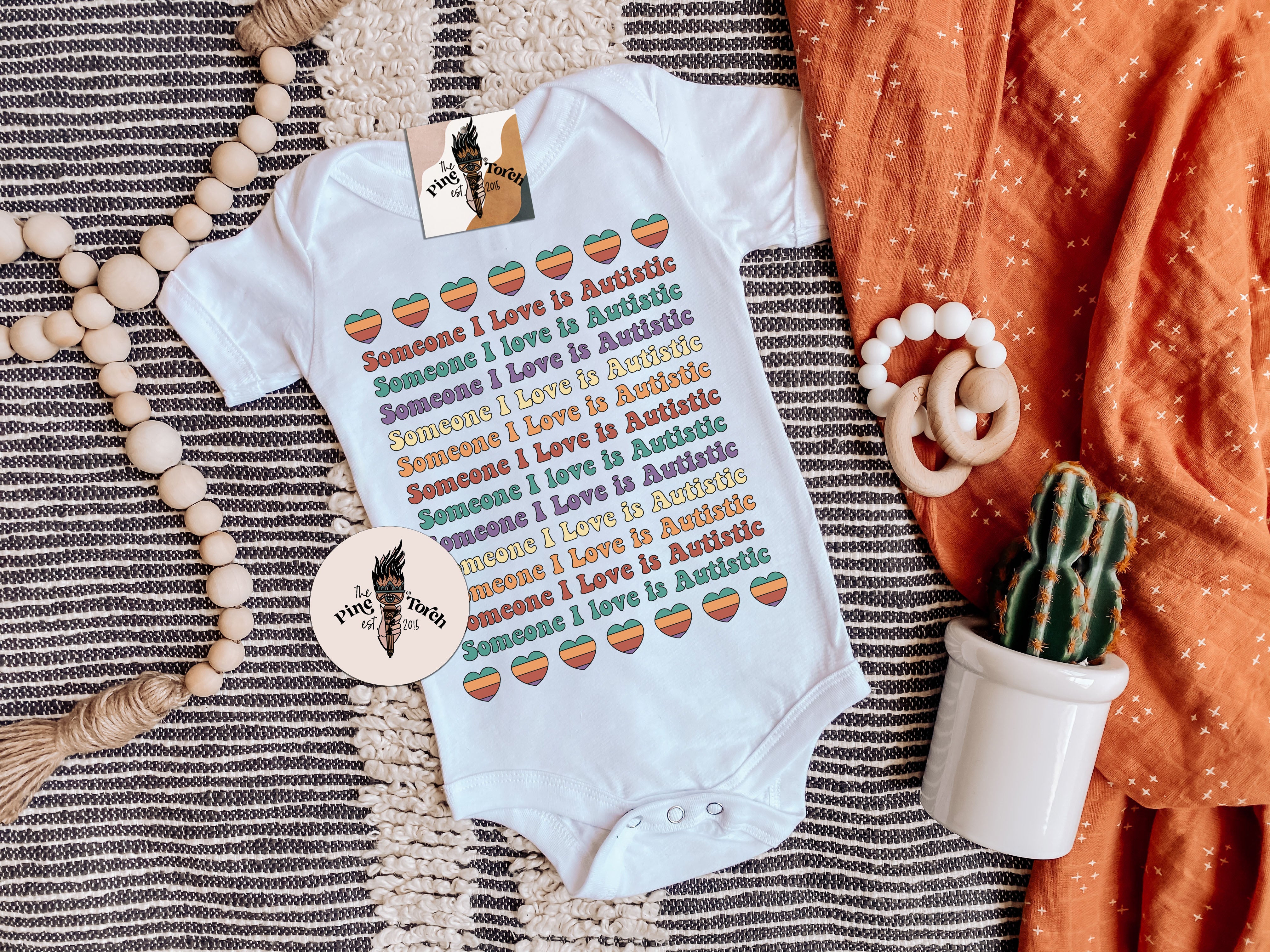 « SOMEONE I LOVE IS AUTISTIC » BODYSUIT