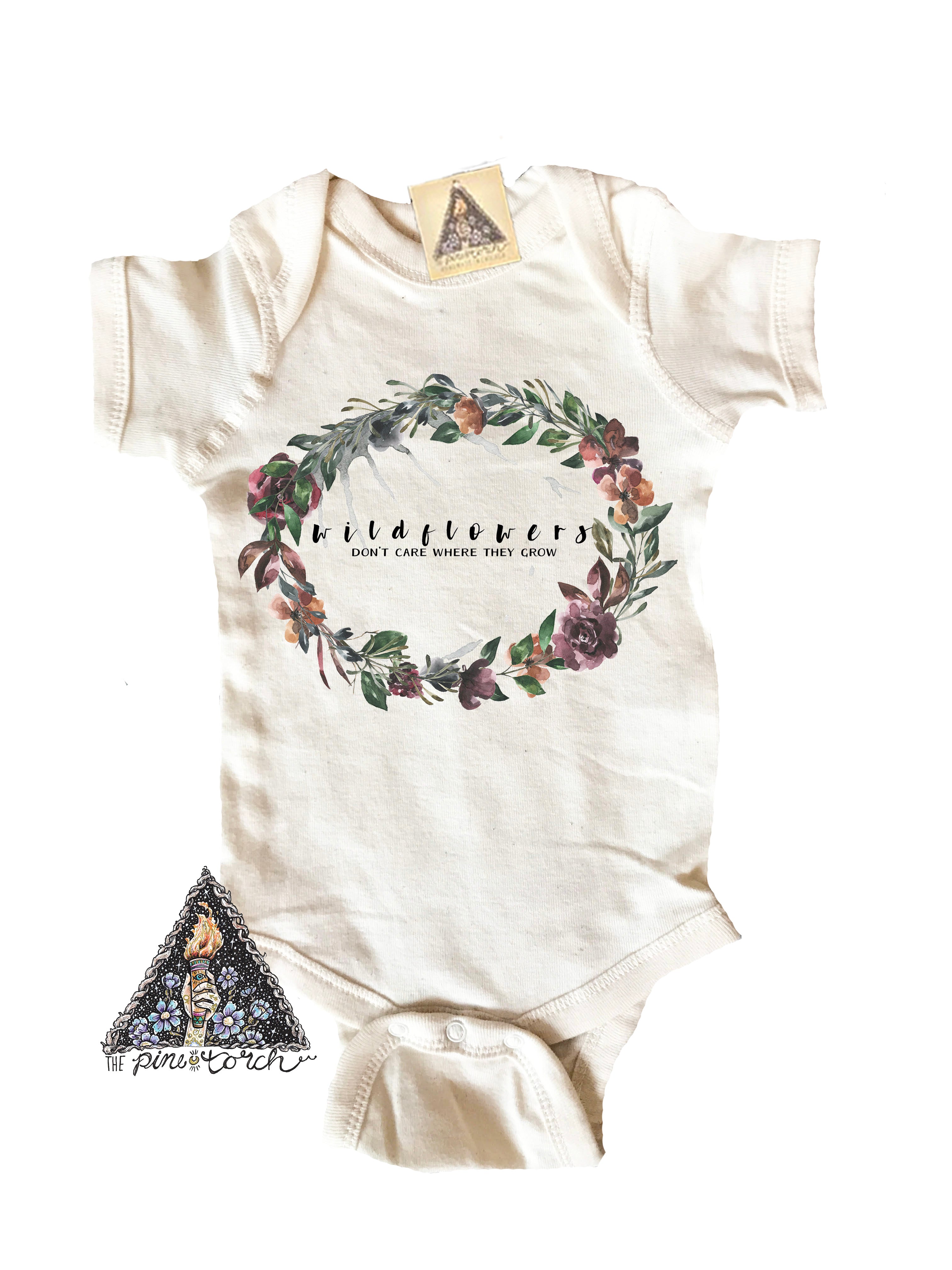 « WILDFLOWERS DON'T CARE WHERE THEY GROW » BODYSUIT