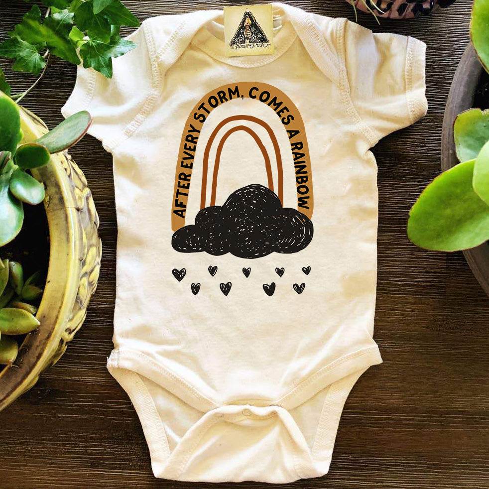 « AFTER EVERY STORM COMES A RAINBOW » BODYSUIT