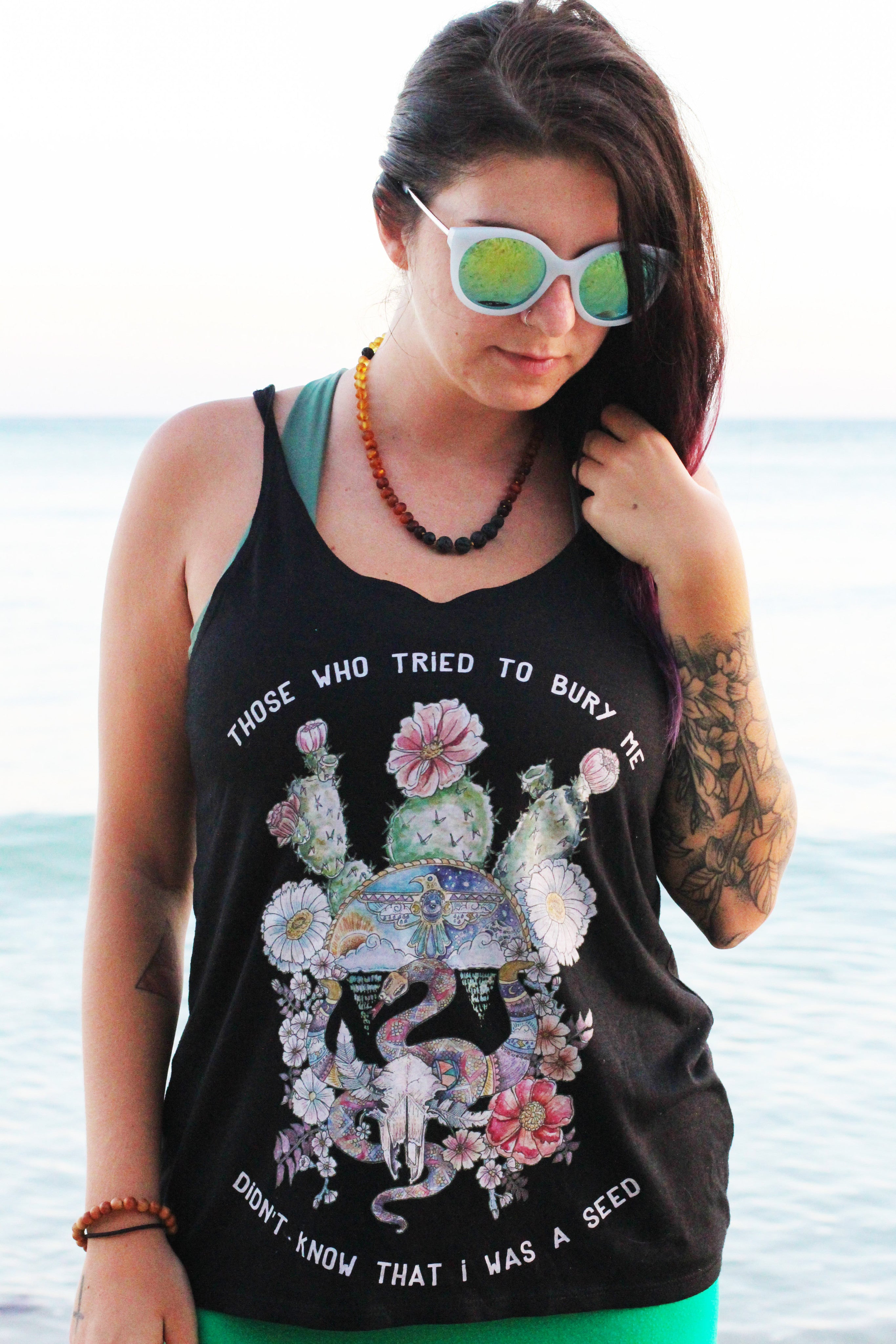 « THOSE WHO TRIED TO BURY ME DIDN'T KNOW THAT I WAS A SEED » WOMEN'S SLOUCHY TANK